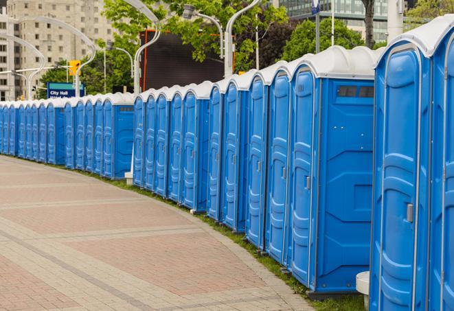 a row of portable restrooms at an outdoor special event, ready for use in Fairview, TX